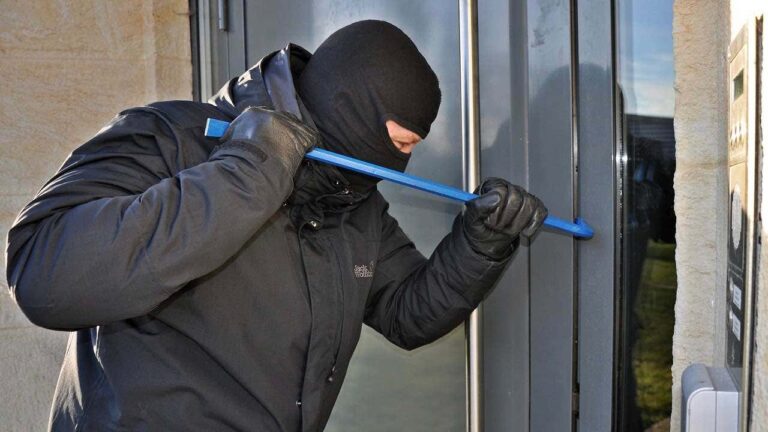 1 Is your home being targeted Burglar with mask breaking in with a crowbar